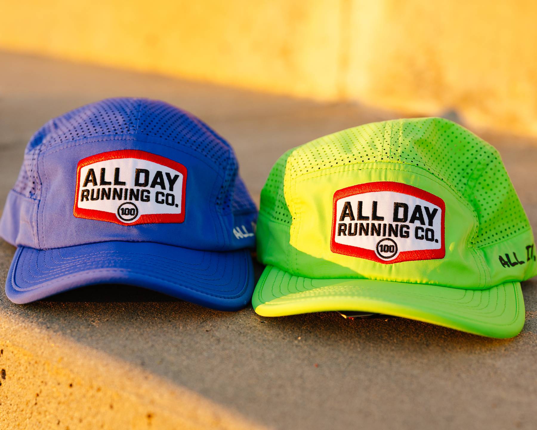 Blue and Green All Day Running Co Team Hats