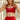 Female runner wearing red sports bra with white All Day Running Co logo with matching red shorts